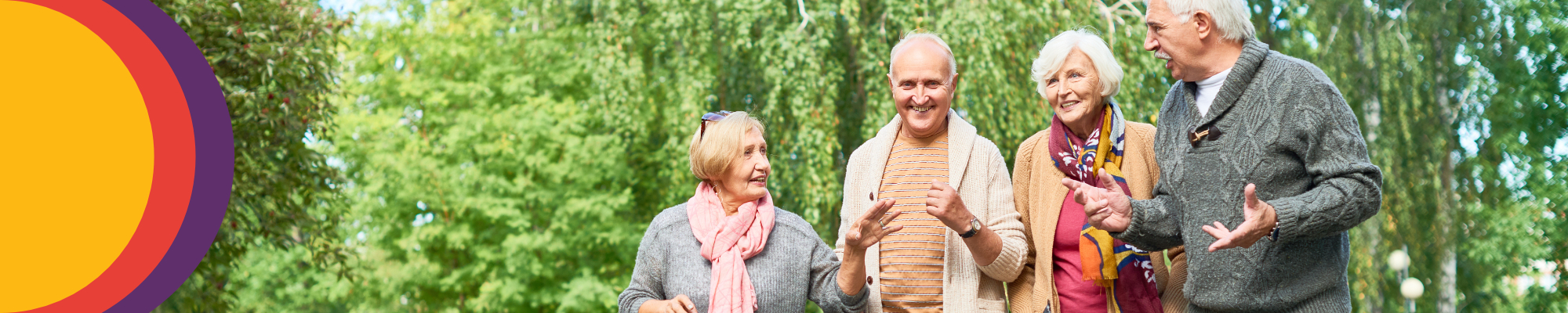 A group of older people walking in a park